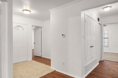 Hallway featuring light hardwood / wood-style floo