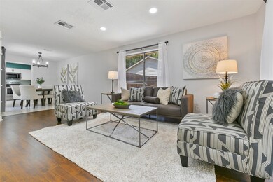 The family room makes a seamless transition into the adjoining dining area, making entertaining a breeze! Also, note the easy-to-maintain solid flooring that extends throughout all of the main living space.