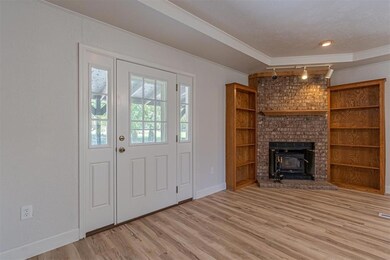 Foyer entrance featuring track lighting, light har
