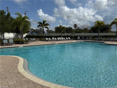 Community pool with a patio