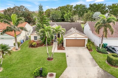 View of front of property featuring a garage and a