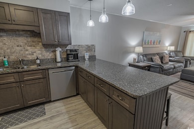 Kitchen featuring light wood finished floors, dish