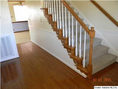 BEAUTIFUL HARDWOODS GREET YOU IN THE FOYER.