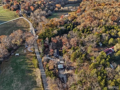 Aerial overview of property's location with a forest