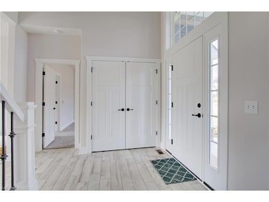 Large Coat Closet in front foyer.  Door leading in