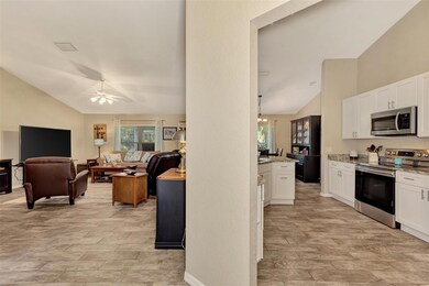 Totally remodeled kitchen on the right; entry to living room on the left