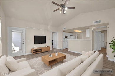 Living area featuring light wood-style flooring, a