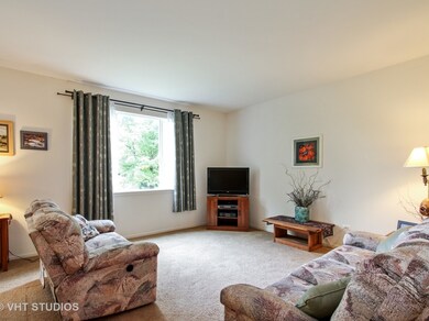 Spacious living room with large windows to allow i