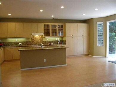 Spacious, gorgeous kitchen with doors leading to b