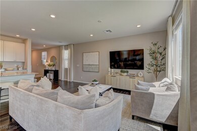 Living room featuring recessed lighting and dark w