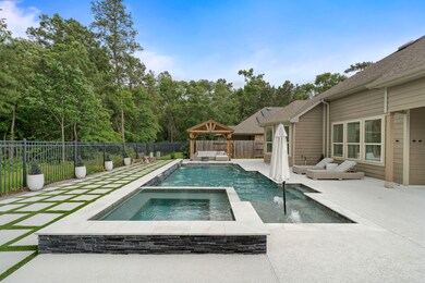 This gorgeous backyard features a heated gunite po