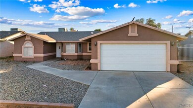 Ranch-style home featuring a garage