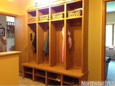 Mud room with cubbies and laundry entry from garag
