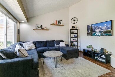 Inviting Main Level Living Room features vaulted c