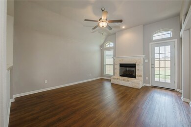 Unfurnished living room with dark wood-type floori