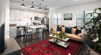 Living room with dark wood-type flooring and sink