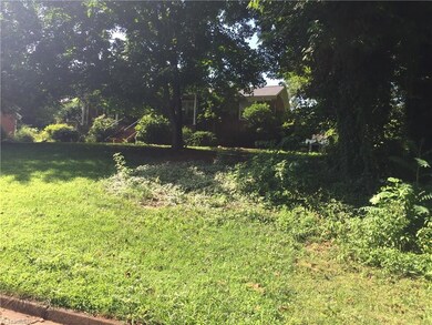 Edge of lot and house next door.