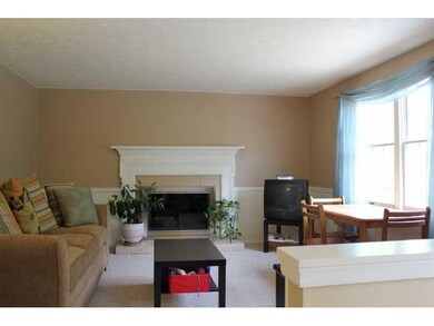 Family Room. Updated layout! Old moldings and rail
