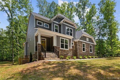 Craftsman-style house featuring a front lawn