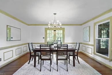 Entertain a crowd in this dining room featuring french doors to the patio