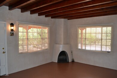 Living room w/corner beehive fireplace.