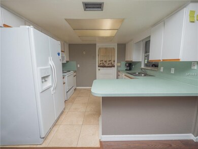 Kitchen with pass through window to lanai and  lea
