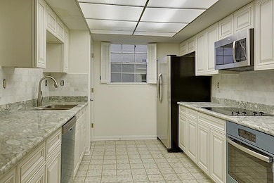 Kitchen w/granite counters and stainless appliance