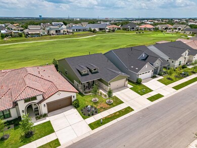 Aerial view of residential area with a local golf