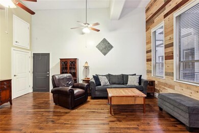 Large living with floor to ceiling windows. High c