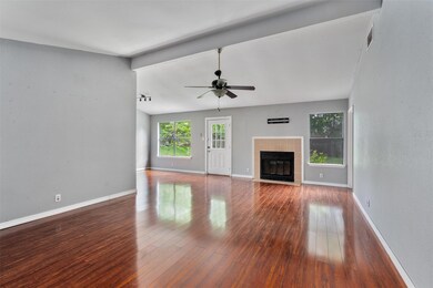 Unfurnished living room with ceiling fan, wood-ty