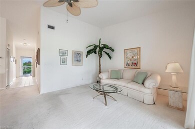 Living room featuring ceiling fan and light colore