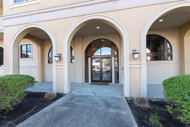 Gorgeous arched entry with secure building access.