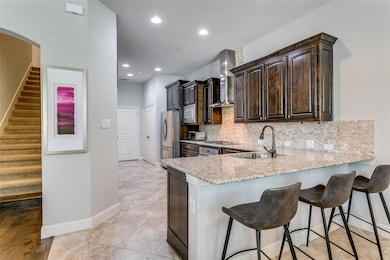 Kitchen boasts an upgraded stainless range hood!  