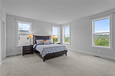 Bedroom featuring baseboards and light colored car