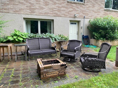 View of patio featuring a fire pit