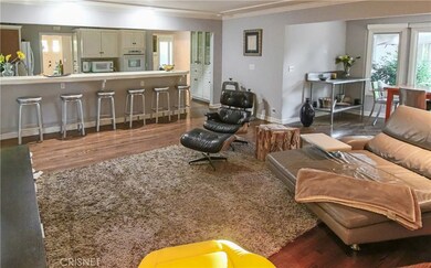 Kitchen opens to family room. Bar seating for the whole gang.