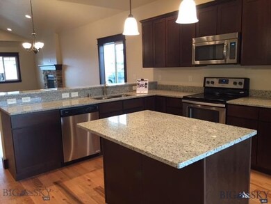 Custom cabinetry with crown Granite Island