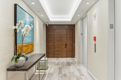  Custom wood-paneled front door.