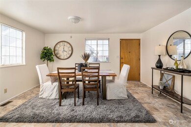 Dining area at rear of home just off of the kitchen, the perfect large gathering space.
