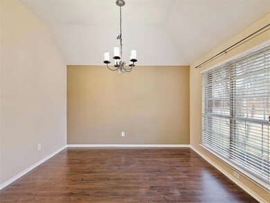Spacious Dining Room with view to front yard.