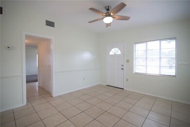 Front door with view into hallway and master bedro