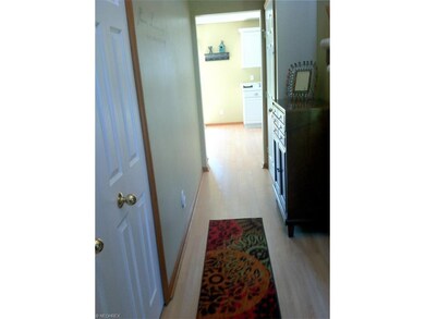 Deep double closet with shelving in the foyer