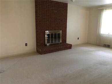 Nice cozy Family room with brick floor to ceiling 