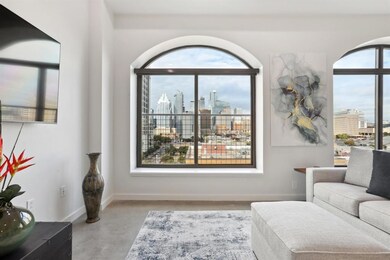 Living room featuring a skyline view, finished co
