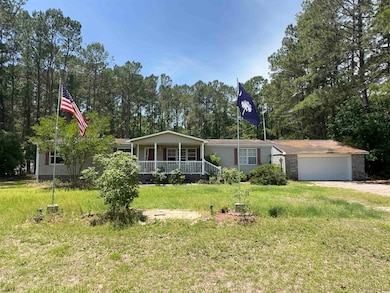 View of front facade featuring covered porch, a fr