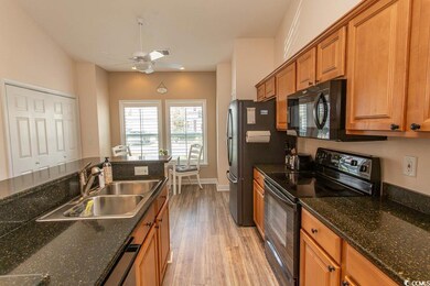 Kitchen with a sink, light wood-type flooring, a c