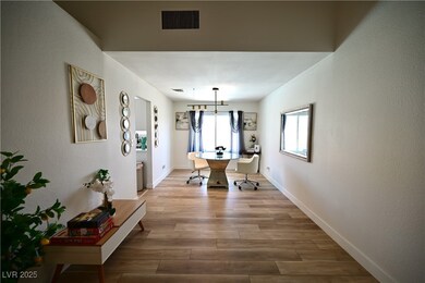 Dining room featuring wood finished floors and bas