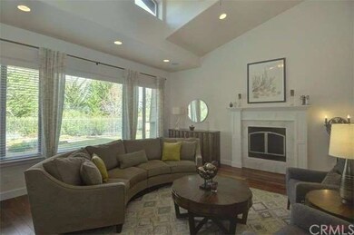 Spacious living room with natural light and vaulte