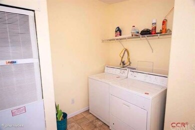 Indoor laundry room with washer and dryer included