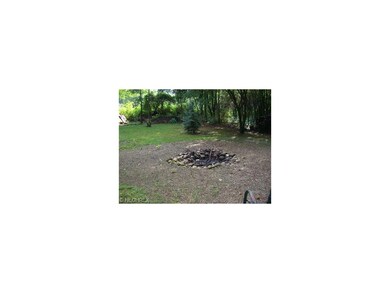 Fire pit in the woods.